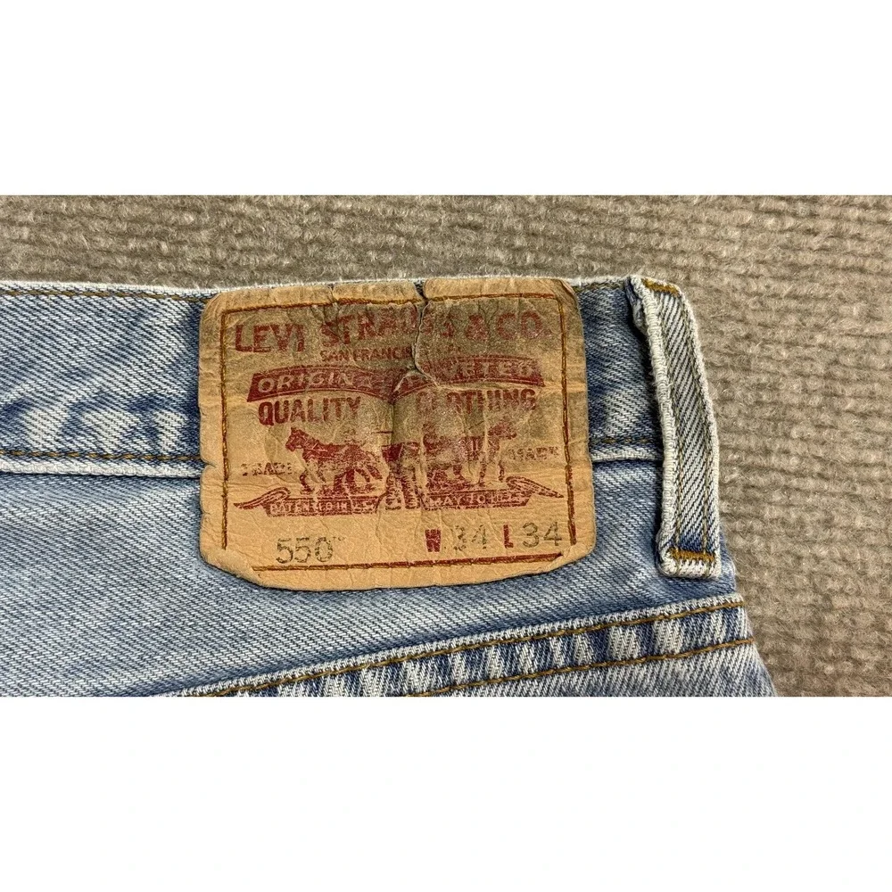 2005 Levis 550 Jeans Mens 34x34 Light‎ Wash Blue Denim Classic black wing